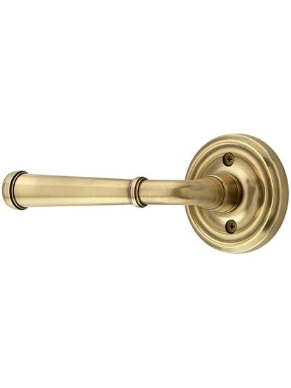 Classic Rosette Door Set with Merrimack Levers Left Handed in Antique Brass.